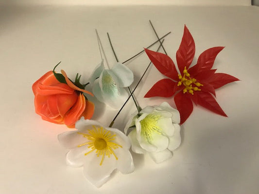 6 STEMS OF PLASTIC FLOWERS, randomly chosen